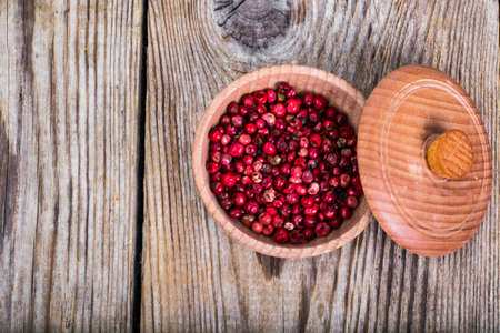 Mix of different bell peppers on wooden backgroundの写真素材