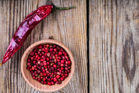 Mix of different bell peppers on wooden backgroundの写真素材