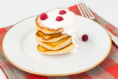 Delicious pancakes with berries and yogurt.の写真素材