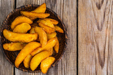 Potato wedges in ruralの写真素材