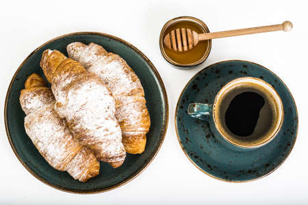 Fresh warm croissants on white backgroundの写真素材