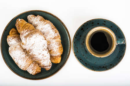Fresh warm croissants on white backgroundの写真素材