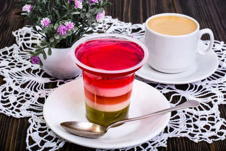 Fruit dessert multicolored jelly and espressoの写真素材