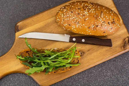 Healthy eating arugula and whole wheat bread. Studio Photoの写真素材