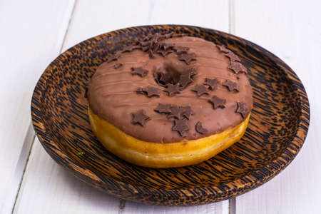Donut with chocolate icing and espressoの写真素材