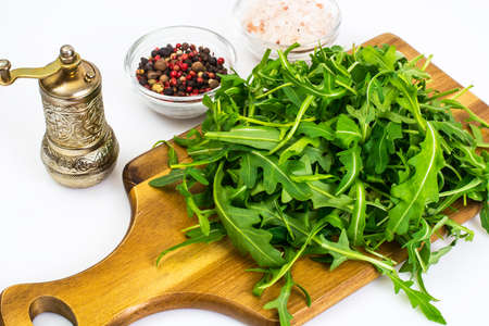 Arugula-ingredient salad on wooden Boards. Studio Photoの写真素材