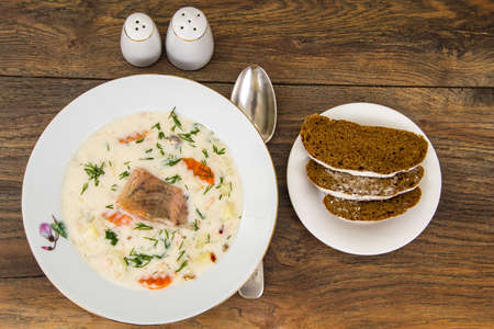 Milk cream soup with vegetables and trout. Studio Photoの写真素材
