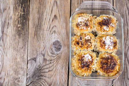 Baked meatballs with rice and vegetables in glass formの写真素材