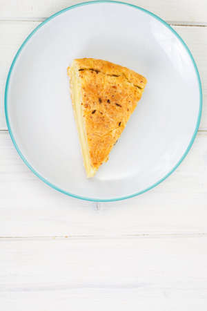 Piece of snack cake with cheese and cumin