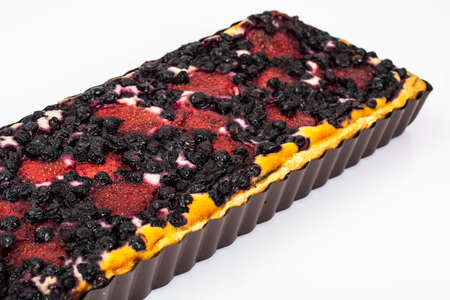 Sand cake with blueberries, strawberries and currants