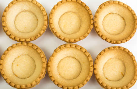 Tartlets empty on white background