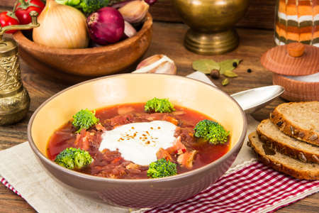 Vegetarian vegetable soup with beet, broccoli and tomatoes