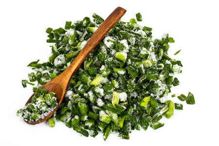 Sliced fresh green onion deep frozen, isolated on white backgrouの写真素材