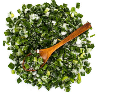 Sliced fresh green onion deep frozen, isolated on white backgrouの写真素材