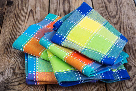 Stack of colored kitchen towels in boxの写真素材