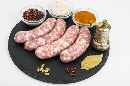 Raw homemade sausage with spicesの写真素材
