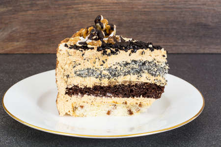 Biscuit cake with poppy seeds, chocolate, nuts