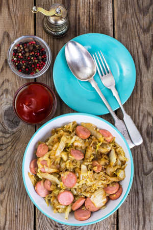 Fried cabbage with sausage. Top viewの写真素材