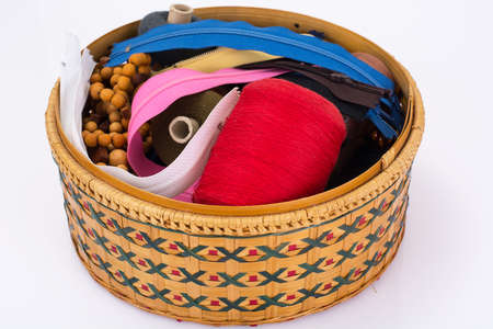 Wicker straw box for sewing accessories. Studio Photo