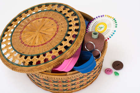 Wicker straw box for sewing accessories. Studio Photoの写真素材