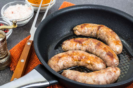Sausage home pork, fried in frying pan. Studio Photoの写真素材