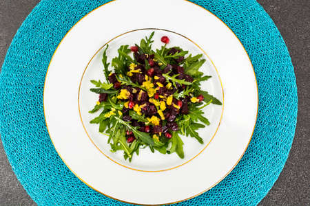 Vegetarian salad with arugula, beetroot and pomegranateの写真素材
