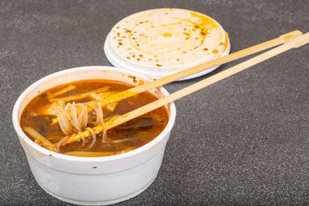 Spicy soup with rice noodles and tofu cheeseの写真素材