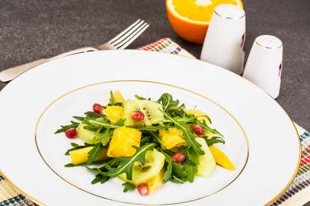 Fruit and vegetable salad with arugulaの写真素材