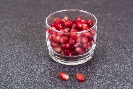 Small glass with dried fruits, nuts, pomegranateの写真素材