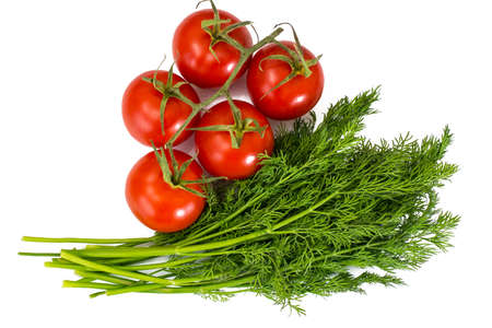 Bunch of fresh dill and branch of red tomatoesの写真素材