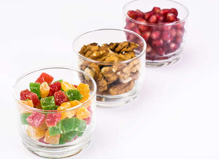 Small glass with dried fruits, nuts, pomegranateの写真素材