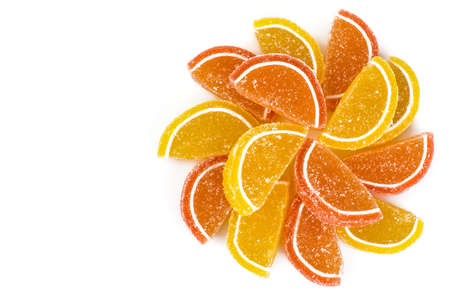 Orange and lemon jelly slices on white backgroundの写真素材