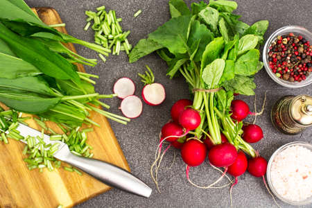 Spring greens radishes and wild garlic, sliced for vegetarian sa