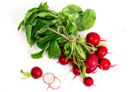 Bunch of washed fresh red radish, isolated on white backgroundの写真素材