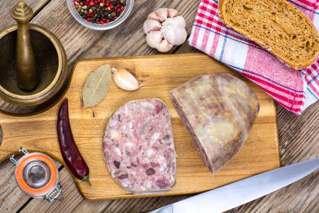 Piece of fresh cutlet with cut sliceの写真素材