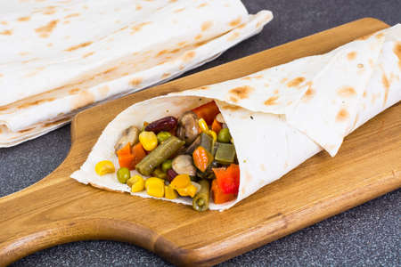 Roll of pita bread with vegetables and mushrooms. Studio Photoの写真素材