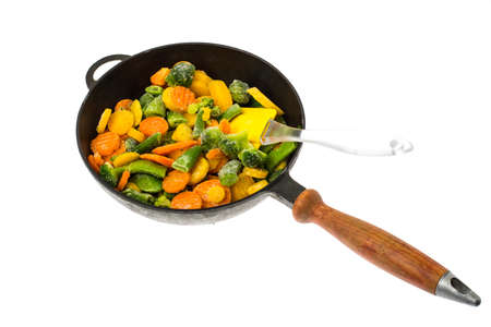 Frozen vegetables in cast-iron frying pan. Studio Photoの写真素材