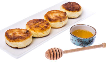 Fried curd cheese cakes on white background.の写真素材