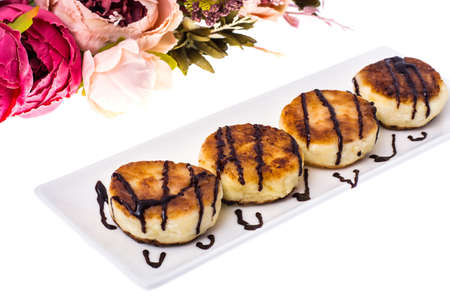 Fried curd cheese cakes on white background.
