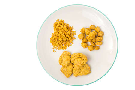 Vegetarian food dry soy products meat on plate.