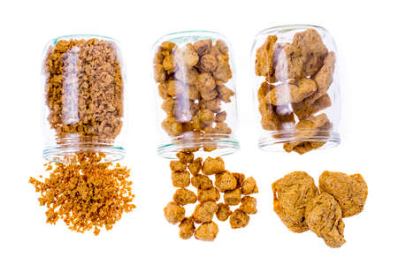 Different types of textured soy protein (meat) on white backgrou