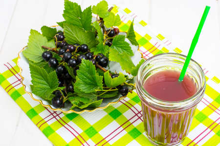 Useful vitamin fresh juice in glass on wooden tableの写真素材