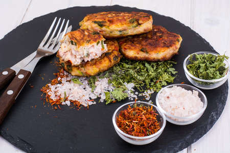 Meat dishes on black stone plate