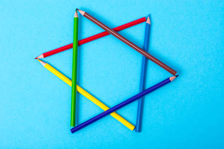 Colored pencils on bright pastel paperの写真素材