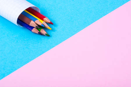 Colored pencils on bright pastel paperの写真素材