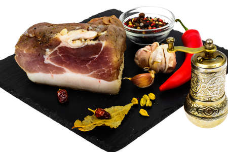 Piece of salted ham with spicesの写真素材