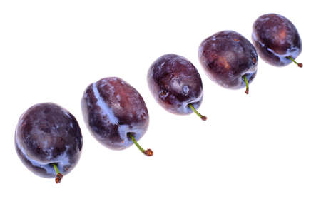 Prunes whole and cut, isolated on white background