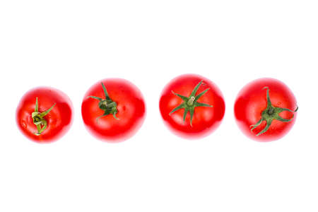 Several red ripe tomatoes isolated on white backgroundの写真素材
