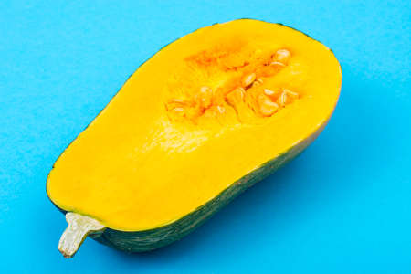 Half of pumpkin on bright backgroundの写真素材