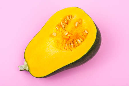 Half of pumpkin on bright backgroundの写真素材